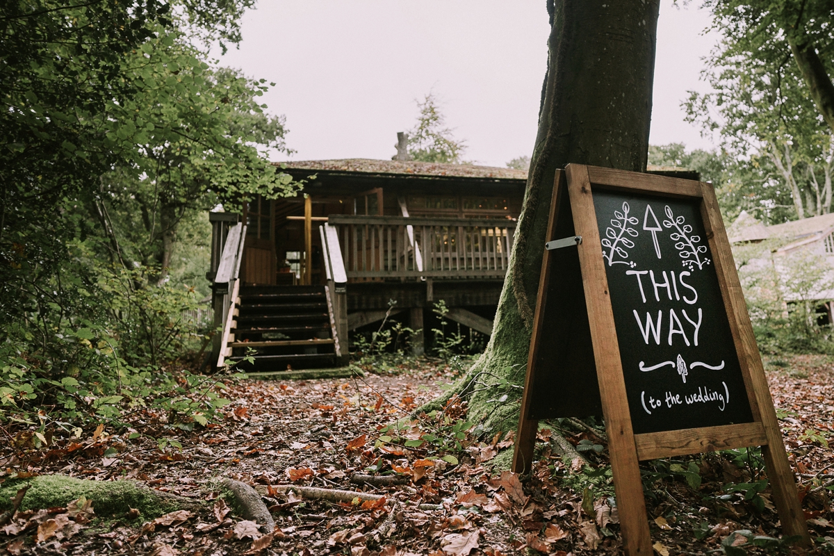 6 A bride wearing a Moonsoon dress for her treetop Autumn wedding