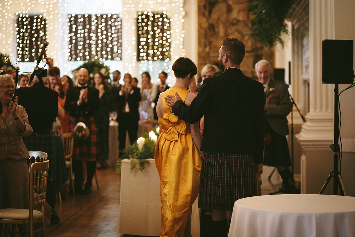 66 A yellow 1970s vintage Christian Dior gown and cape for a modern alternative Scottish wedding