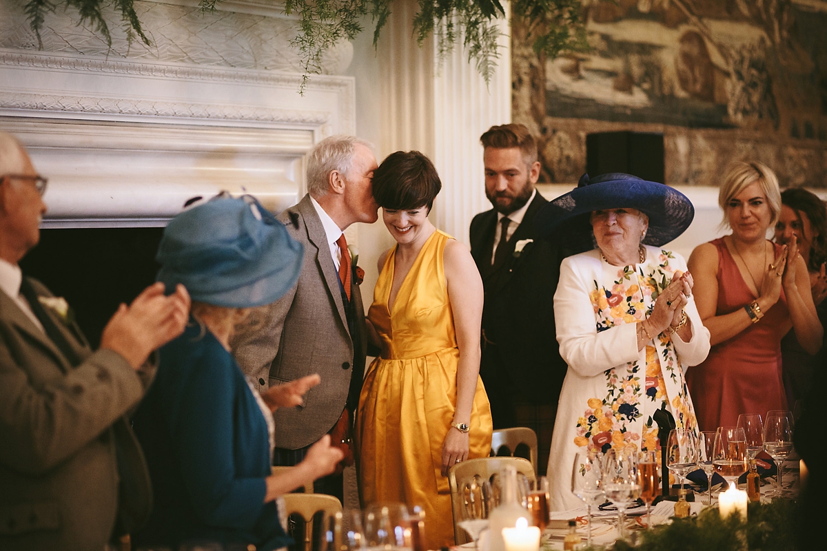 67 A yellow 1970s vintage Christian Dior gown and cape for a modern alternative Scottish wedding