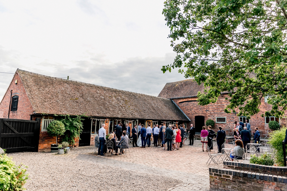 7 A Pronovias backless gownf or a simple relaxed barn wedding