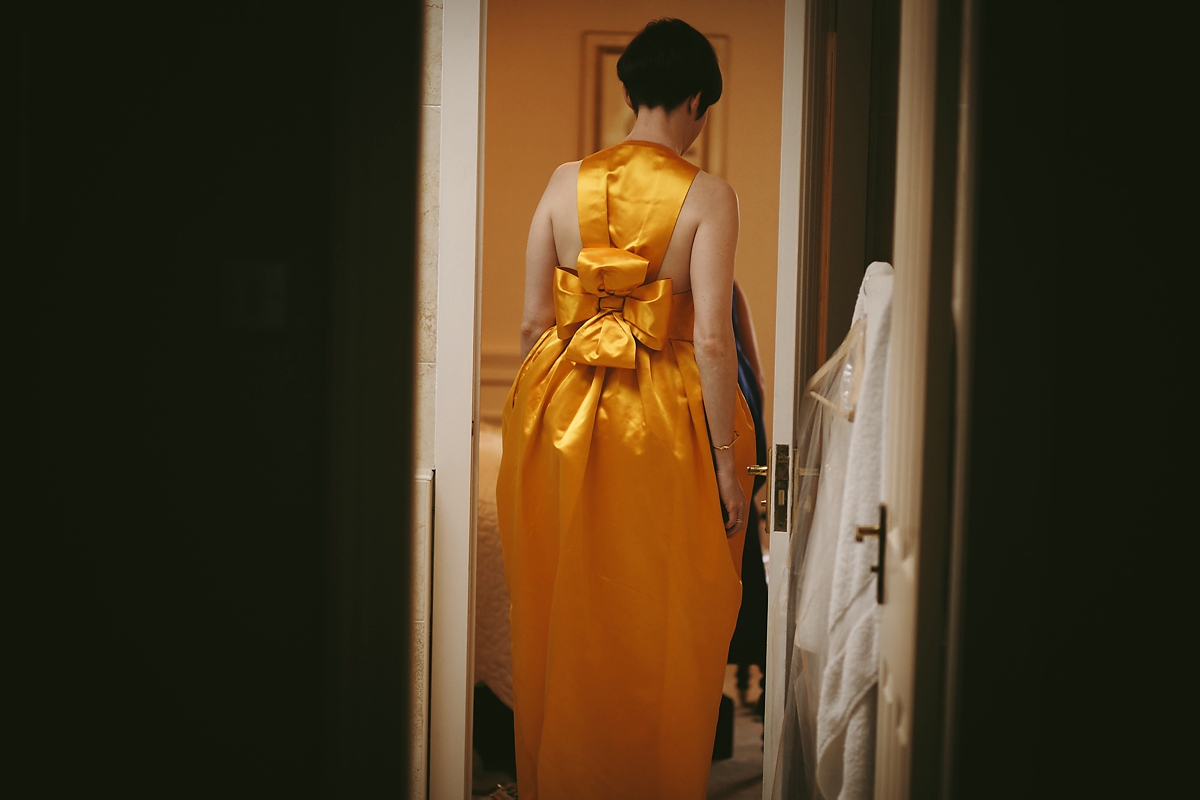 7 A yellow 1970s vintage Christian Dior gown and cape for a modern alternative Scottish wedding