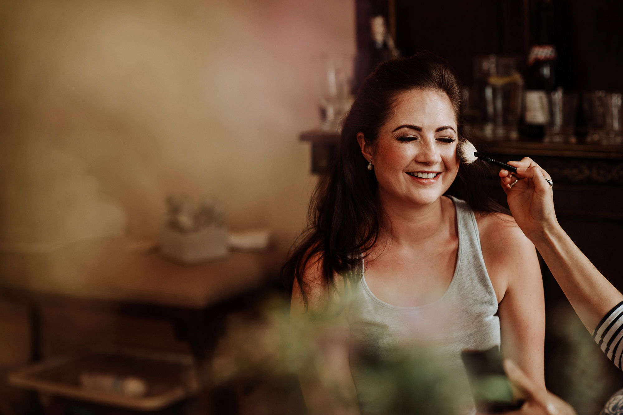 01 A bride getting her hair and makeup applied