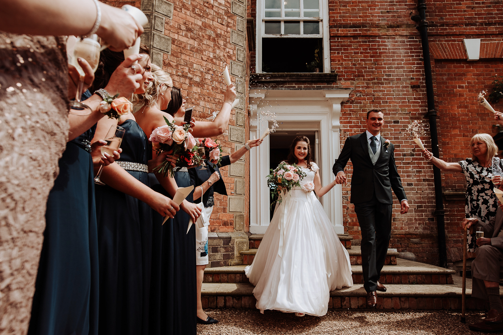 01 A bride wearing Naomi Neoh as she exits for her confetti shot