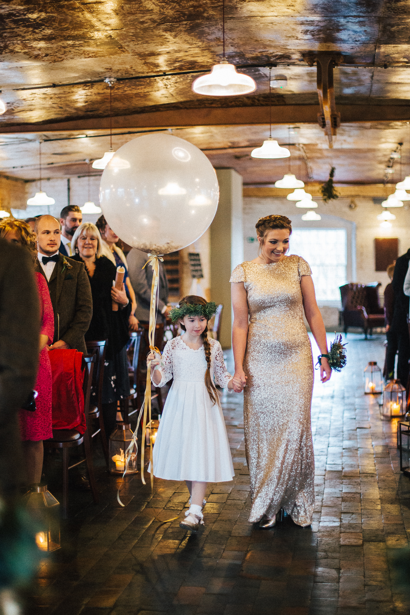 01 Bridesmaid wearing a sequin dress and flowergirl carrying a large balloon