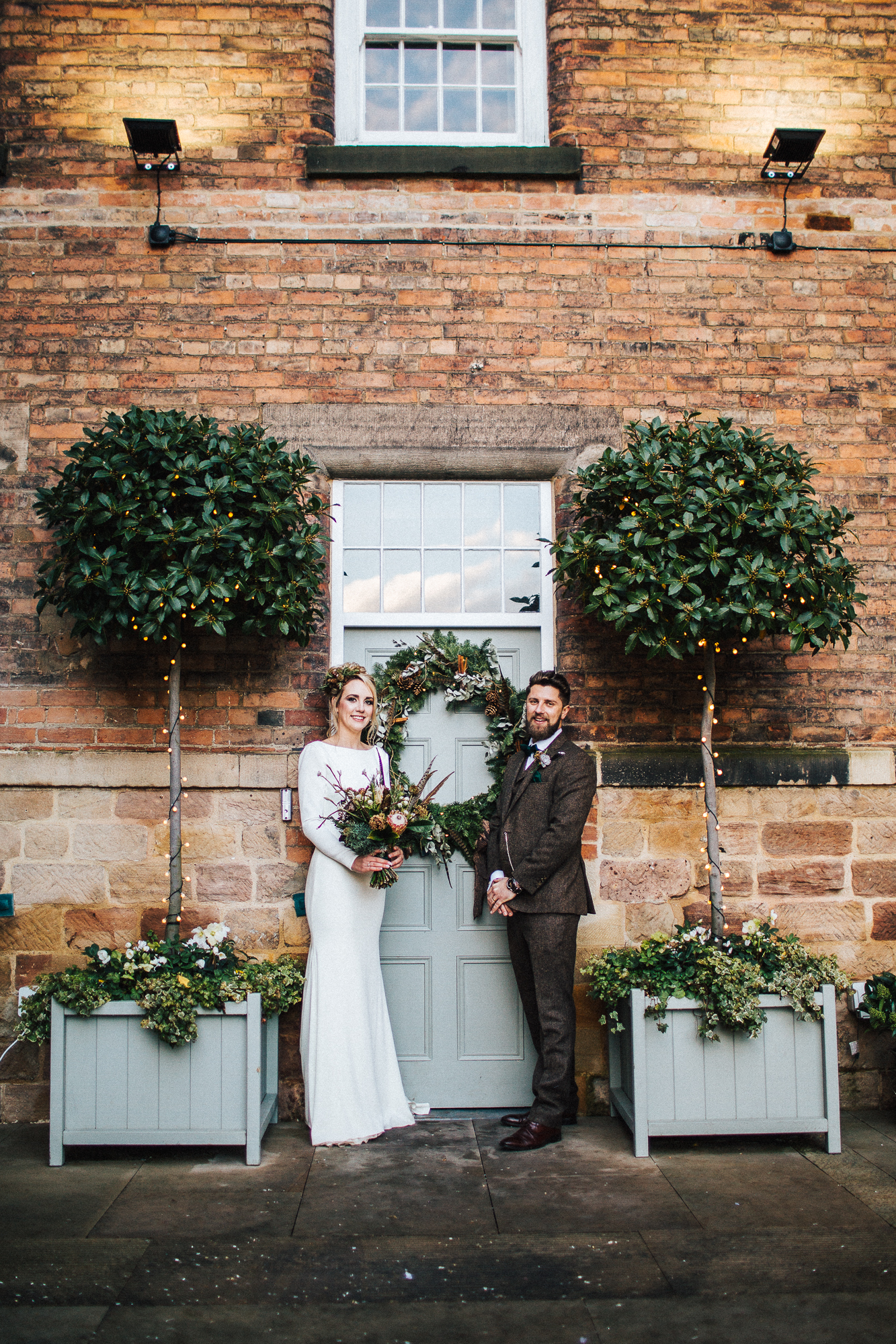 01 Winter wedding at West Mill Derbyshire the bride wears a long sleeved backless Pronovias dress