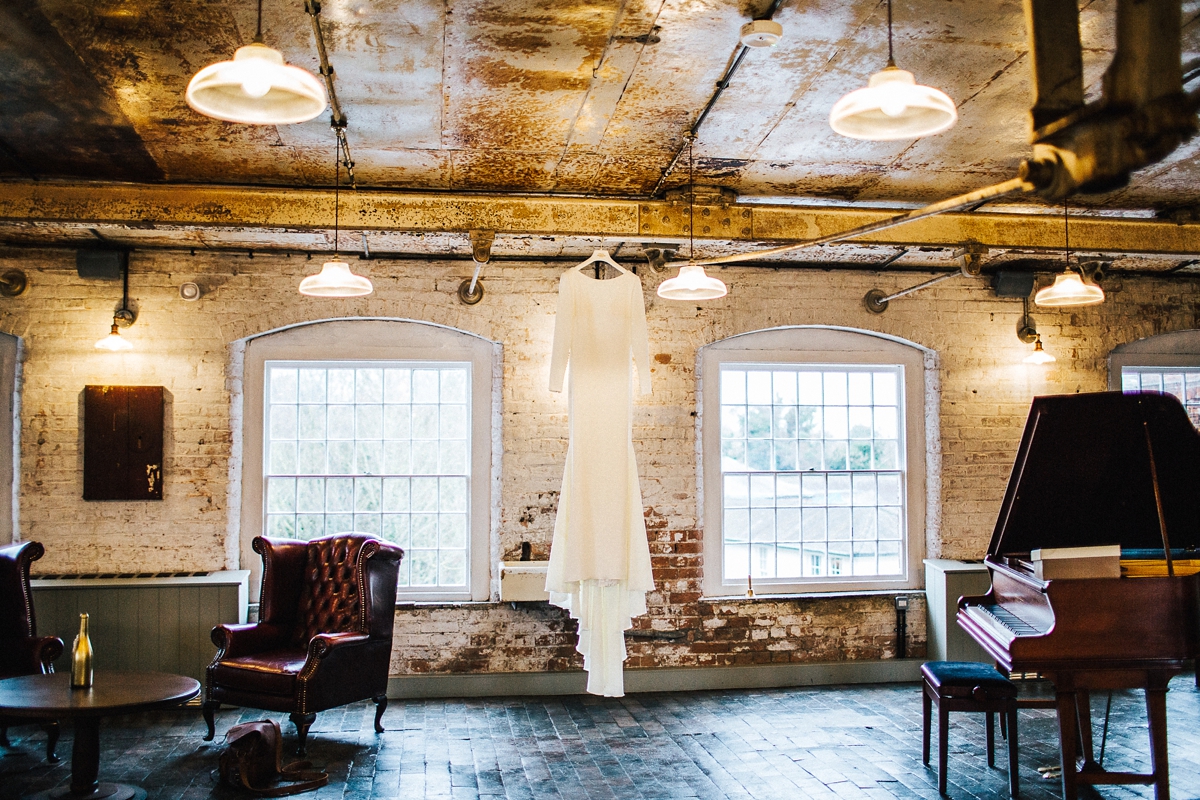 1 A long sleeved Pronovias gown for a glamorous winter wedding at West Mill in Derbyshire