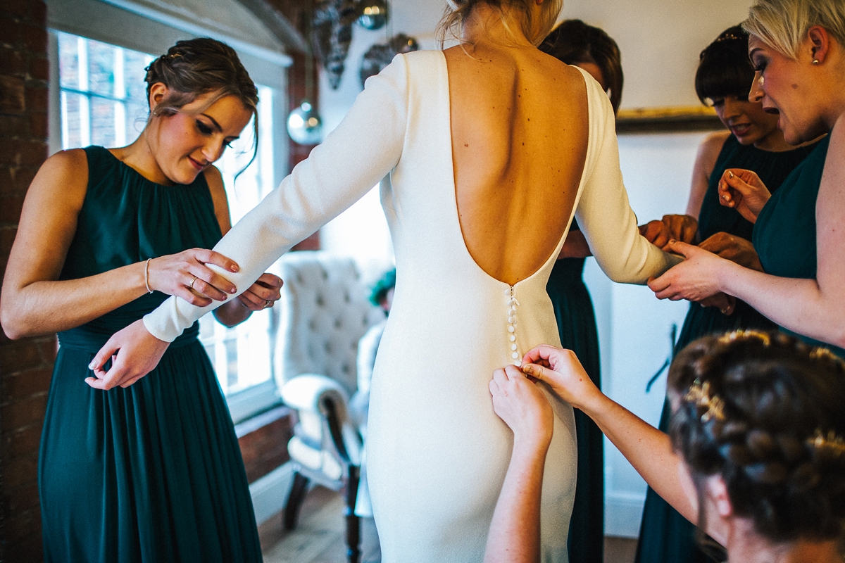 11 A long sleeved Pronovias gown for a glamorous winter wedding at West Mill in Derbyshire