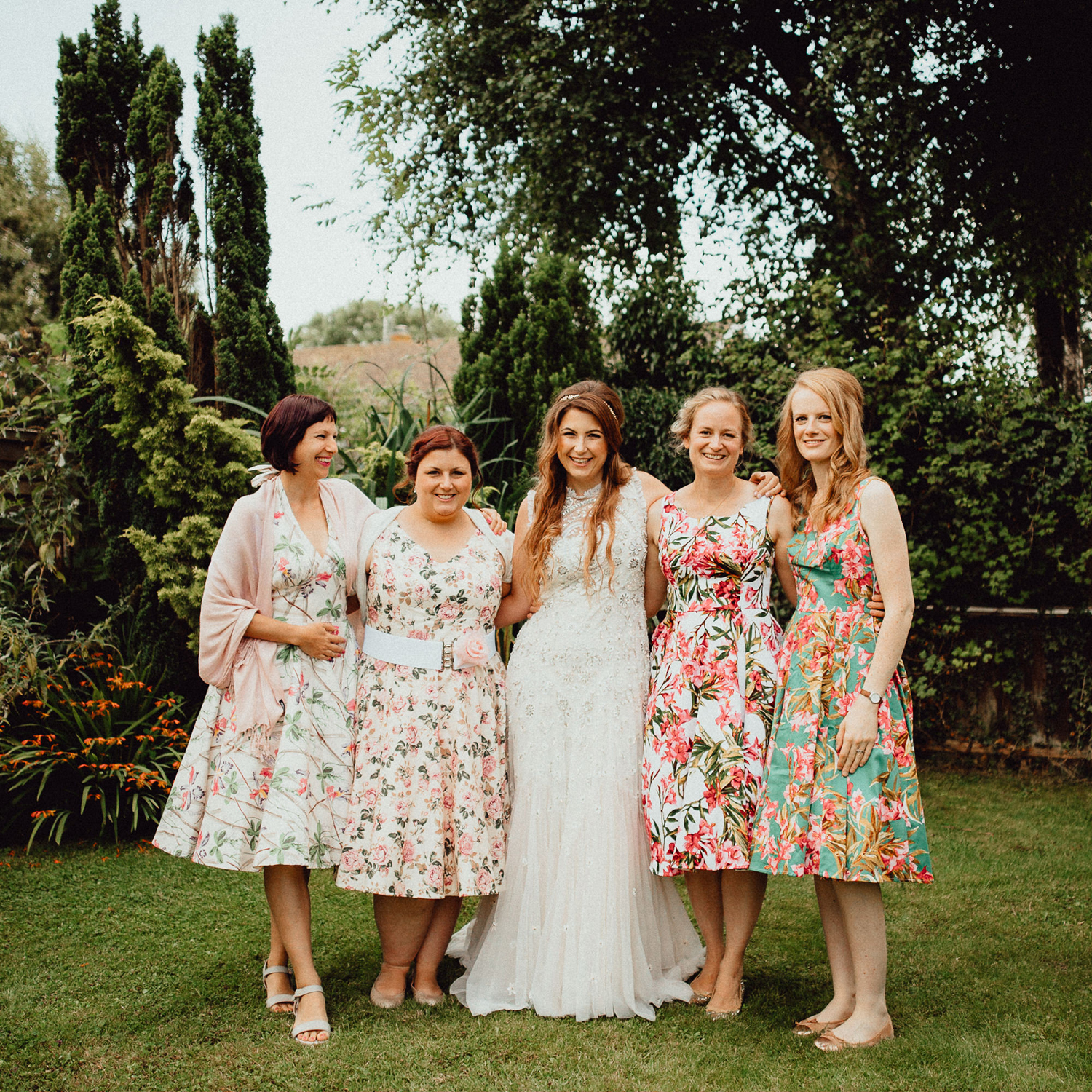 12 Bridesmaids in floral 1950s inspired dresses