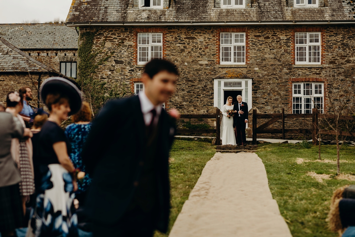 23 A long sleeved Justin Alexander dress for an elegant Glasshouse Wedding