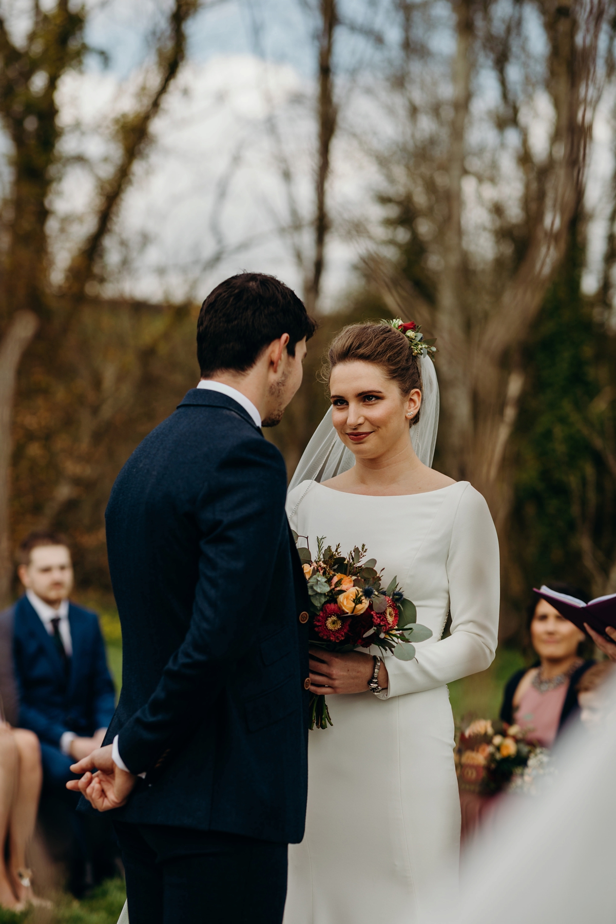 24 A long sleeved Justin Alexander dress for an elegant Glasshouse Wedding