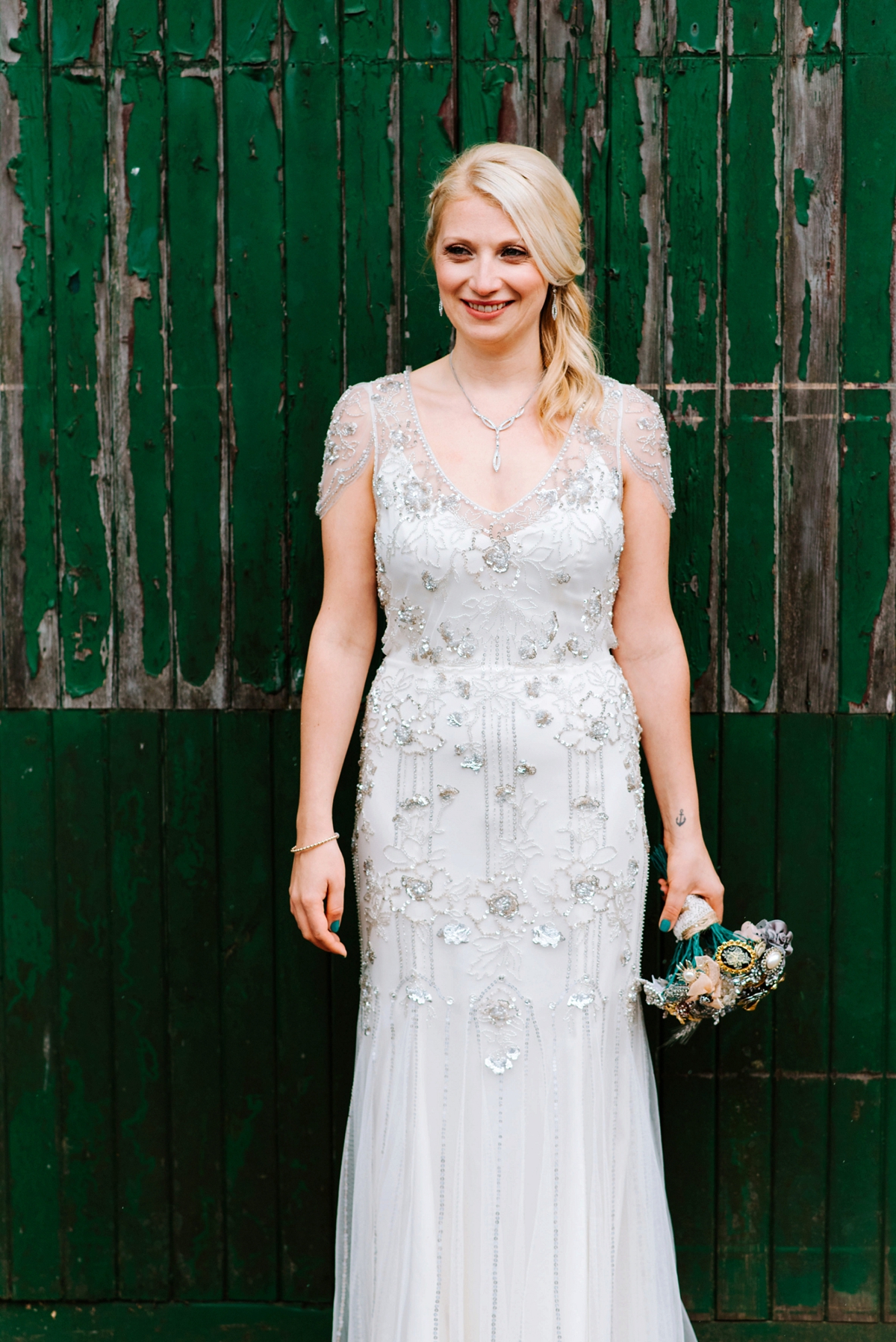 26 A Jenny Packham beaded gown for a lovely laidback country barn wedding