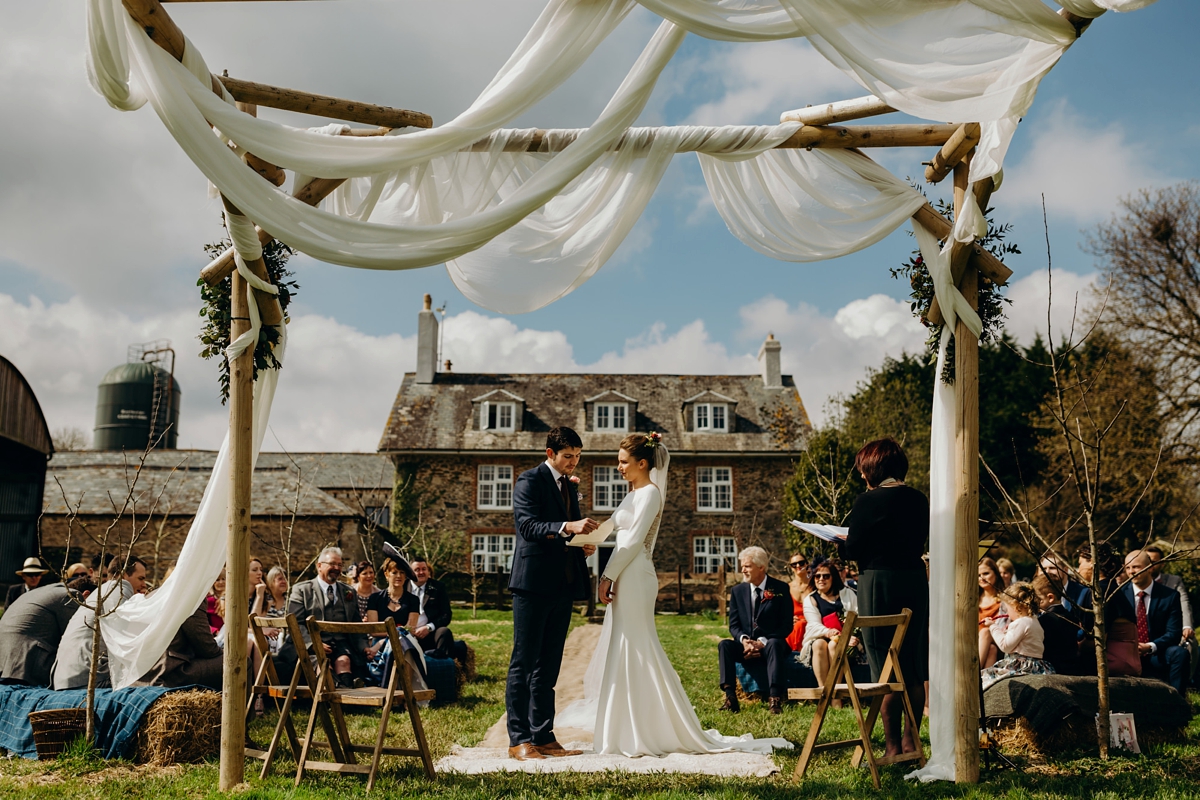 28 A long sleeved Justin Alexander dress for an elegant Glasshouse Wedding