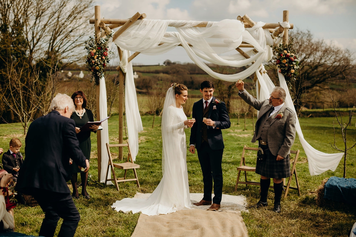 30 A long sleeved Justin Alexander dress for an elegant Glasshouse Wedding