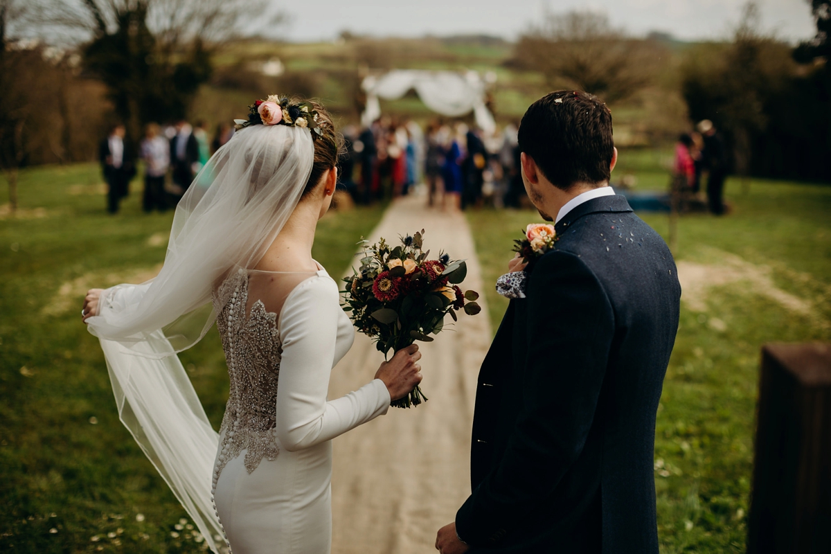 32 A long sleeved Justin Alexander dress for an elegant Glasshouse Wedding