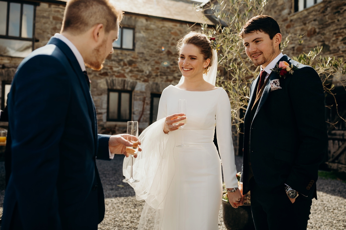 39 A long sleeved Justin Alexander dress for an elegant Glasshouse Wedding