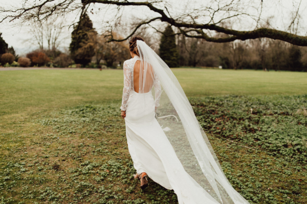 A Backless Emma Beaumont Gown For a Spring Wedding in Whites and Neutrals