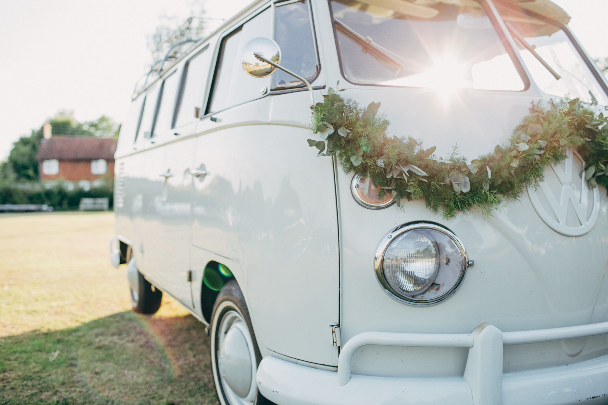 01 vw camper van for a wedding decorated with greenery