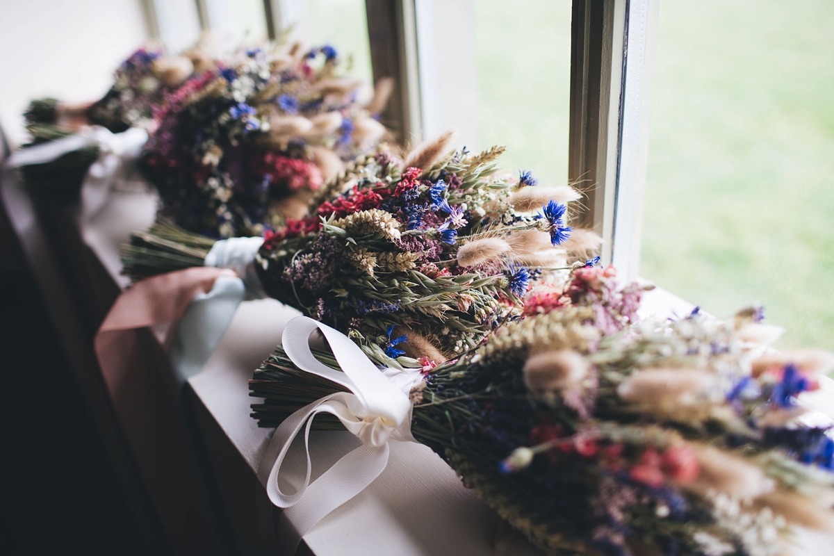 08 A Lambert Creations dress and dried flowers for a rustic barn wedding and online dating love story