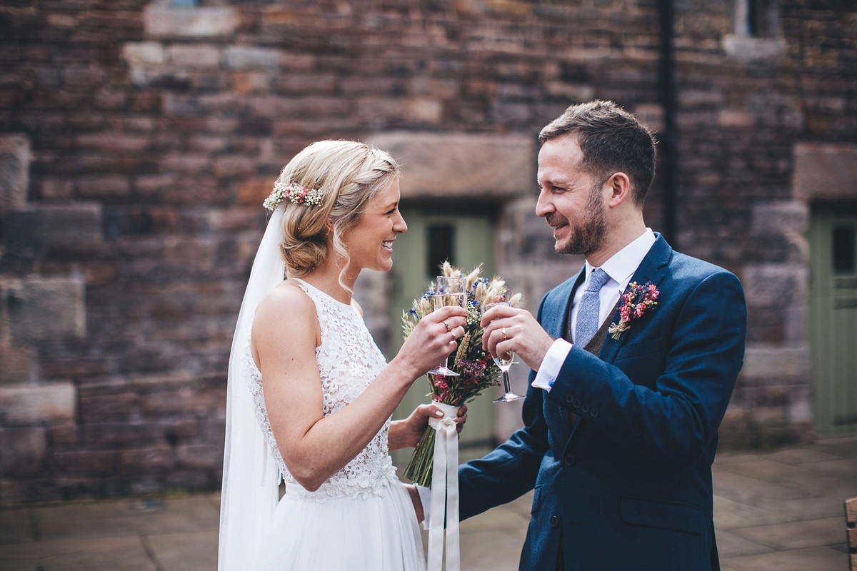 22 A Lambert Creations dress and dried flowers for a rustic barn wedding and online dating love story