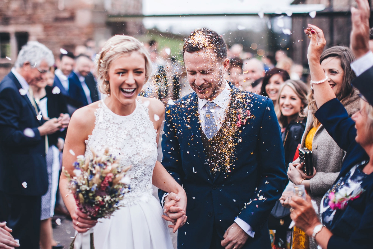 23 A Lambert Creations dress and dried flowers for a rustic barn wedding and online dating love story