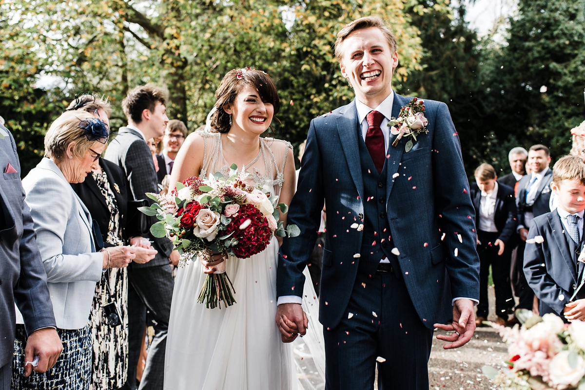 31 Brde wearing Anna Campbell and a groom in Ted Baker just married at Kilworth House. Images by Su Ann Simon