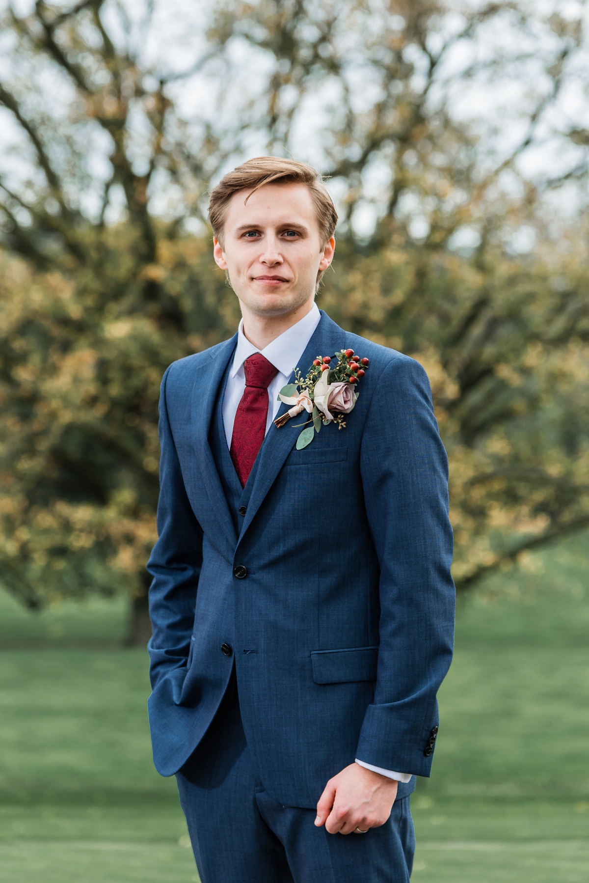 33 Groom in a deep red tie and dark grey Ted Baker wedding suit. Images by Su Ann Simon