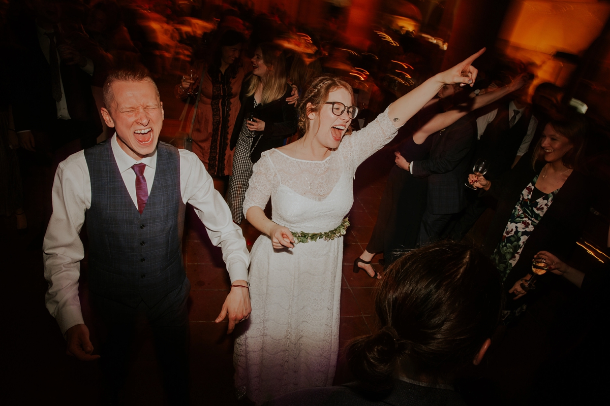 41 A bride in glasses wearing a Kate Beaumont dress for her Leeds city wedding. Images by Jamie Sia