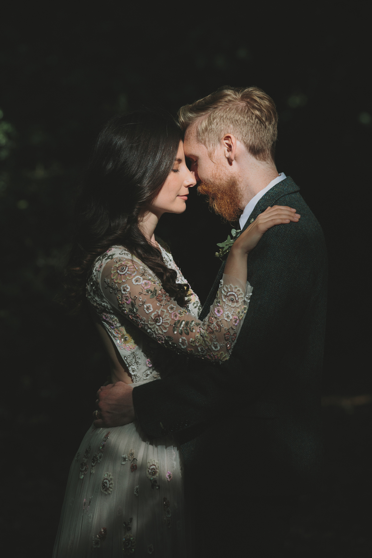 67 Bride in a Needle Thread gown and a Groom with a handlebar moustache and ASOS suit standing in woodland image by McKinley Rodgers