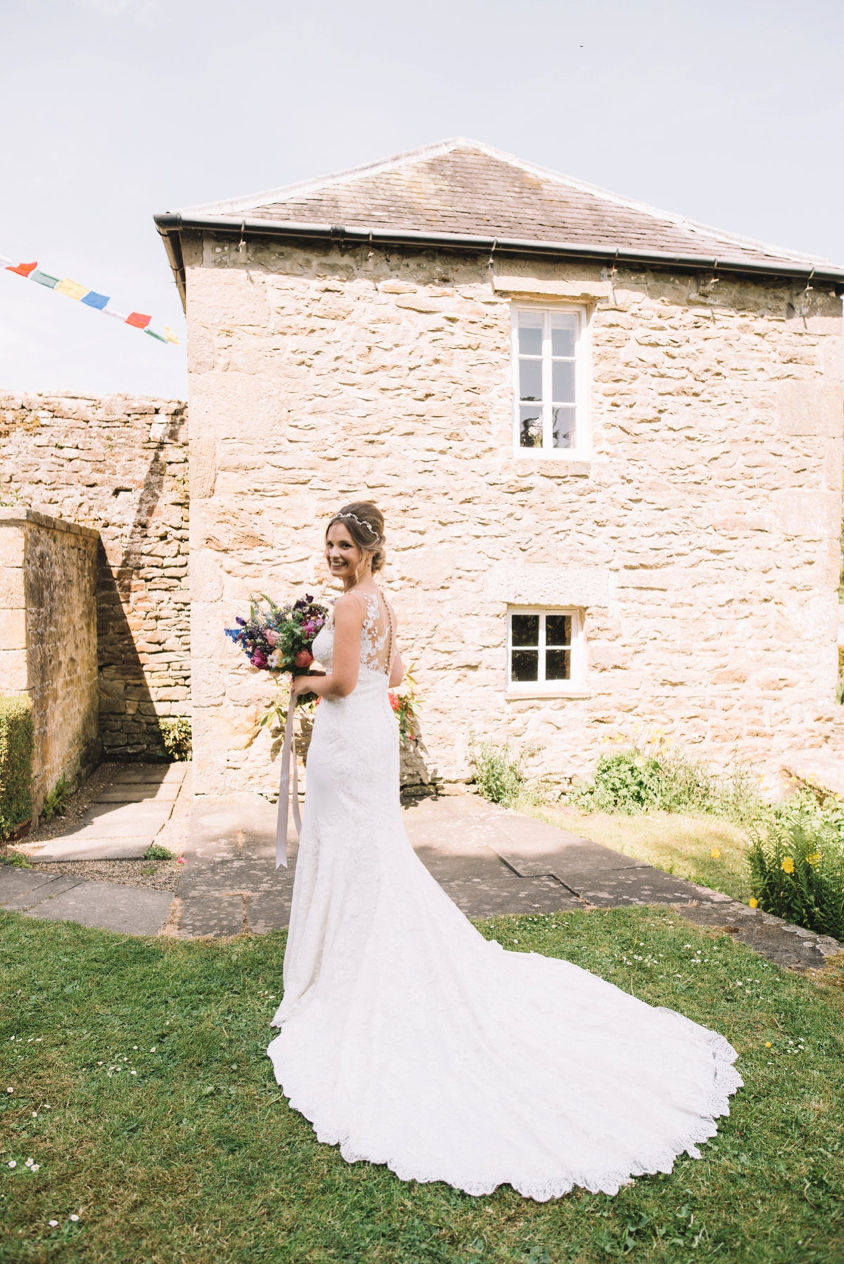 1 A fitted lace Pronovias dress for a colourful walled garden wedding in Northumberland