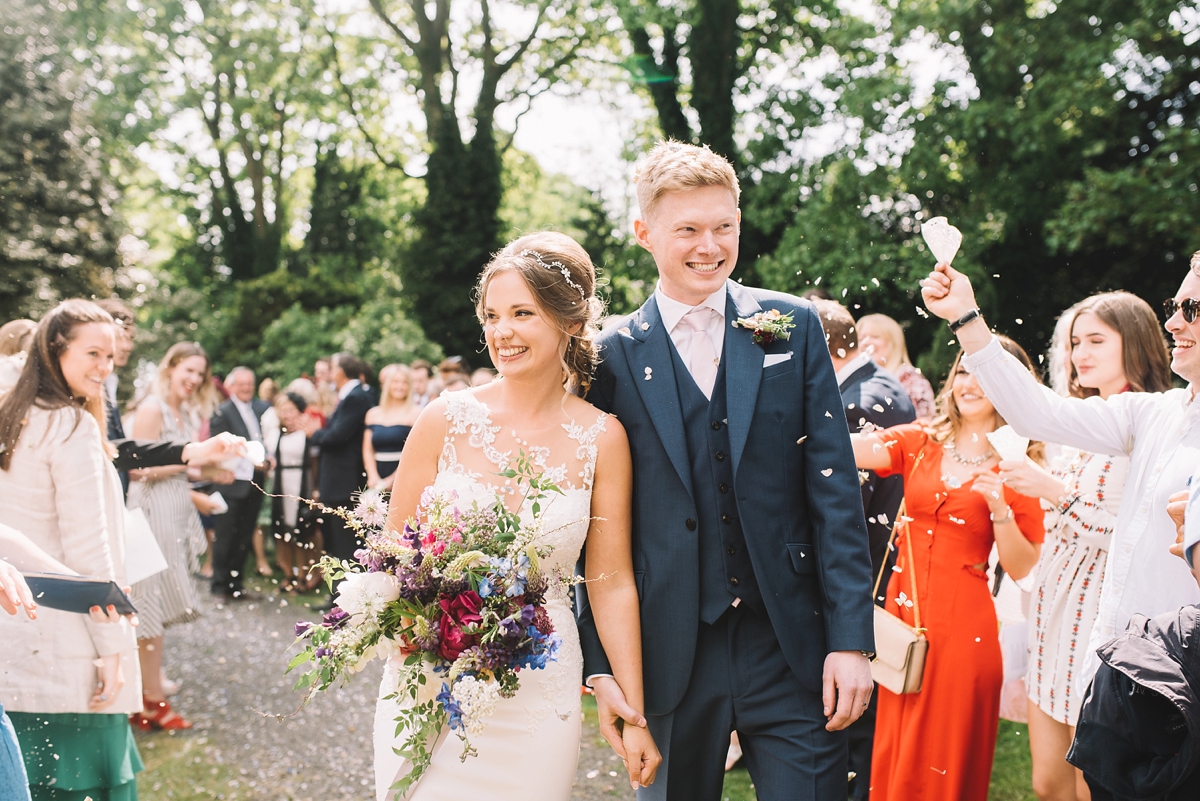 19 A fitted lace Pronovias dress for a colourful walled garden wedding in Northumberland