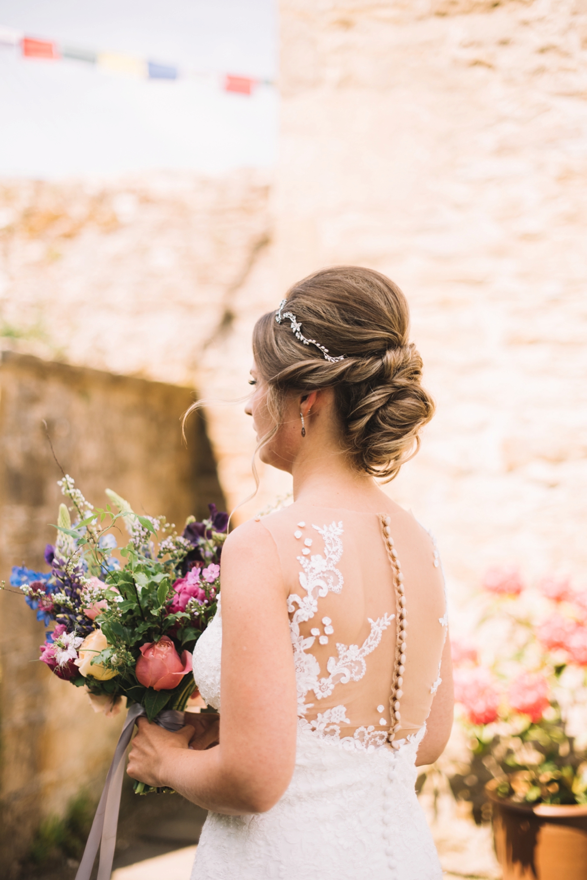 2 A fitted lace Pronovias dress for a colourful walled garden wedding in Northumberland