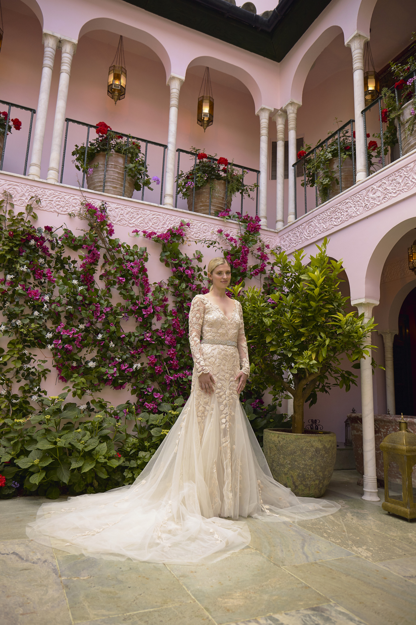 22 Bowen Dryden bridal captured in a pink Marrakech inspired courtyard at Port Lympne Hotel