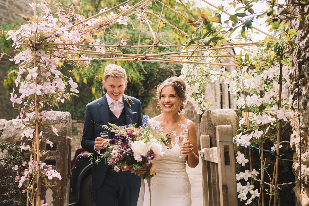 26 A fitted lace Pronovias dress for a colourful walled garden wedding in Northumberland