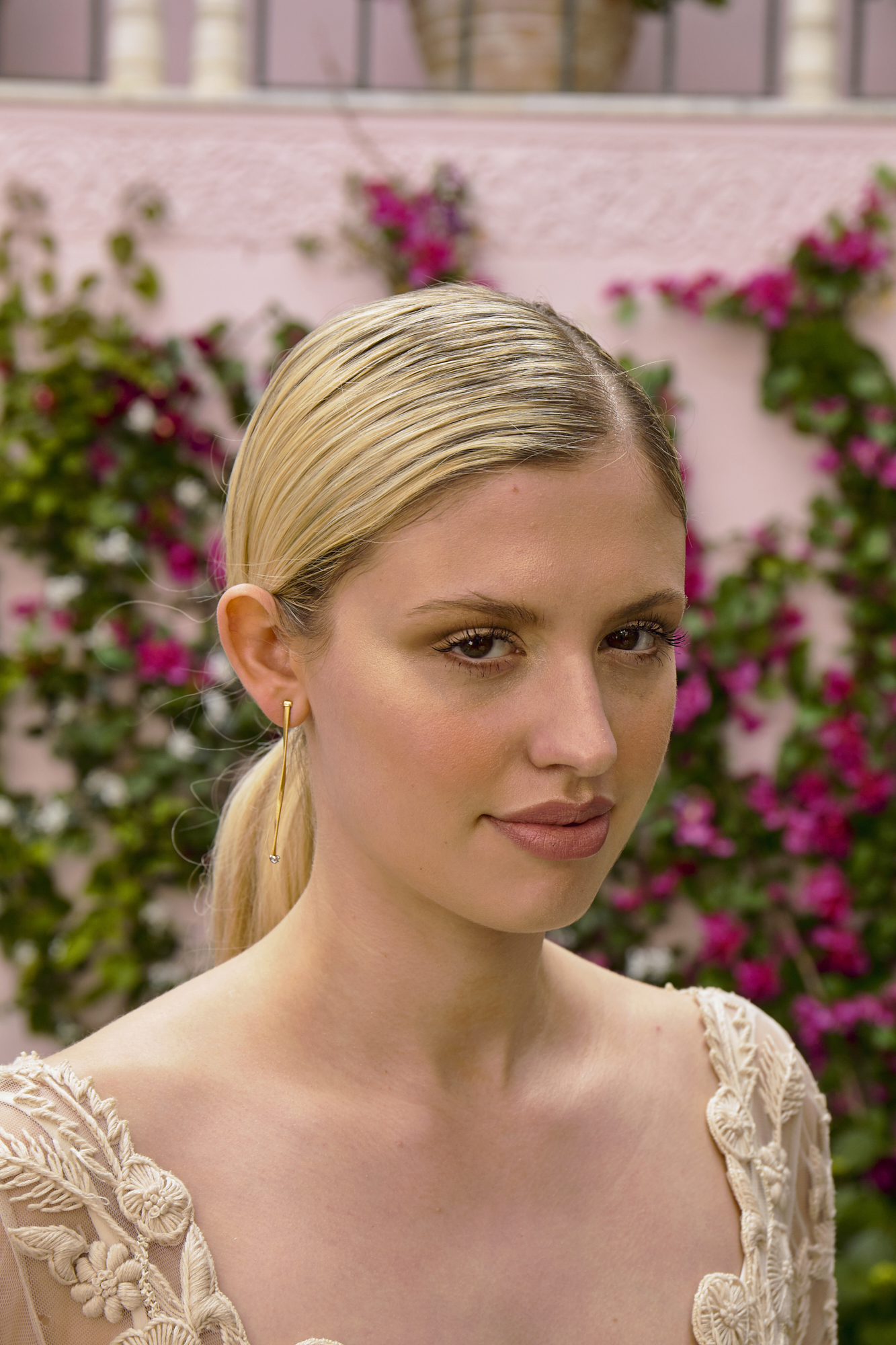 26 Bowen Dryden bridal captured in a pink Marrakech inspired courtyard at Port Lympne Hotel