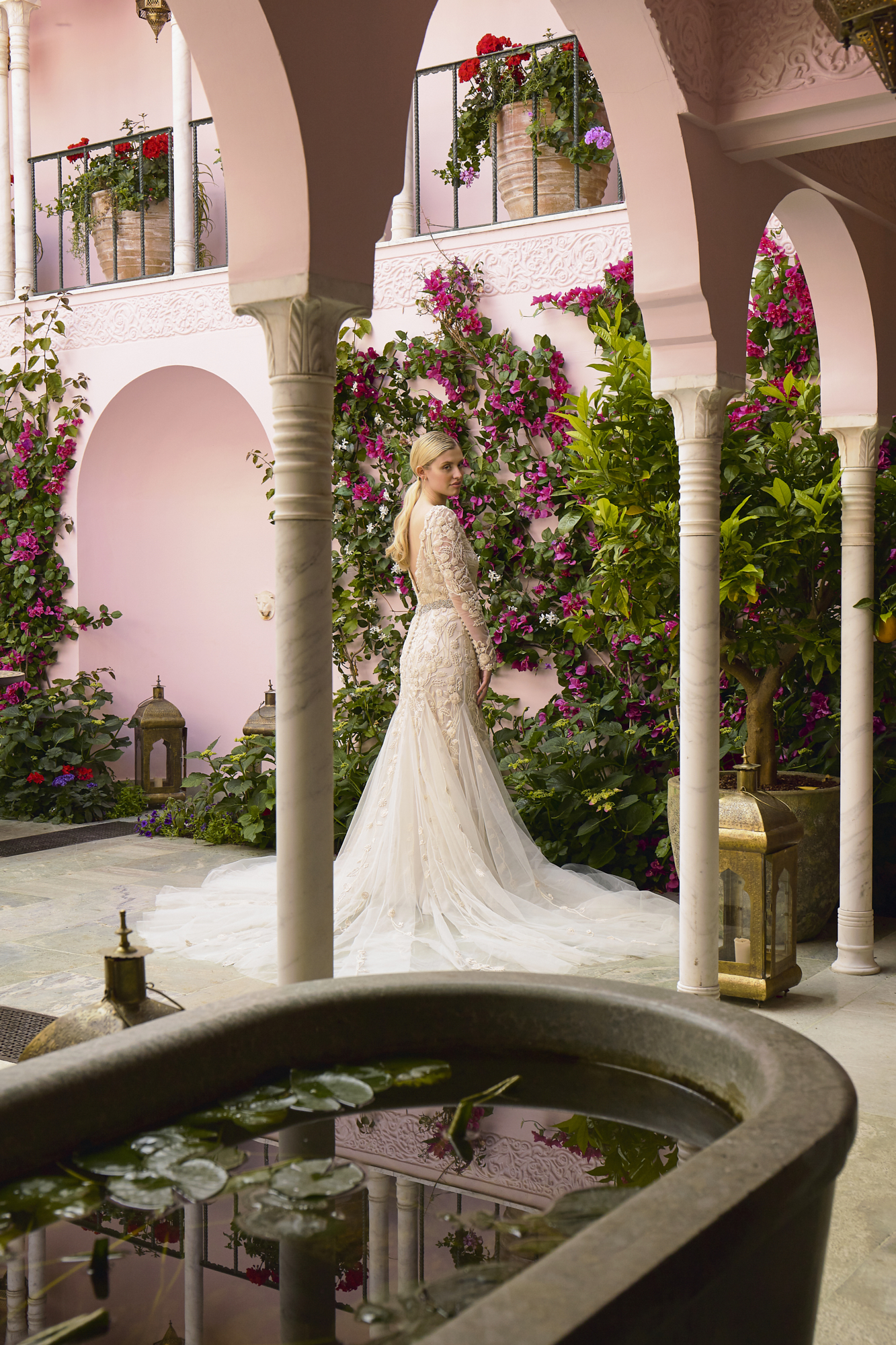 29 Bowen Dryden bridal captured in a pink Marrakech inspired courtyard at Port Lympne Hotel
