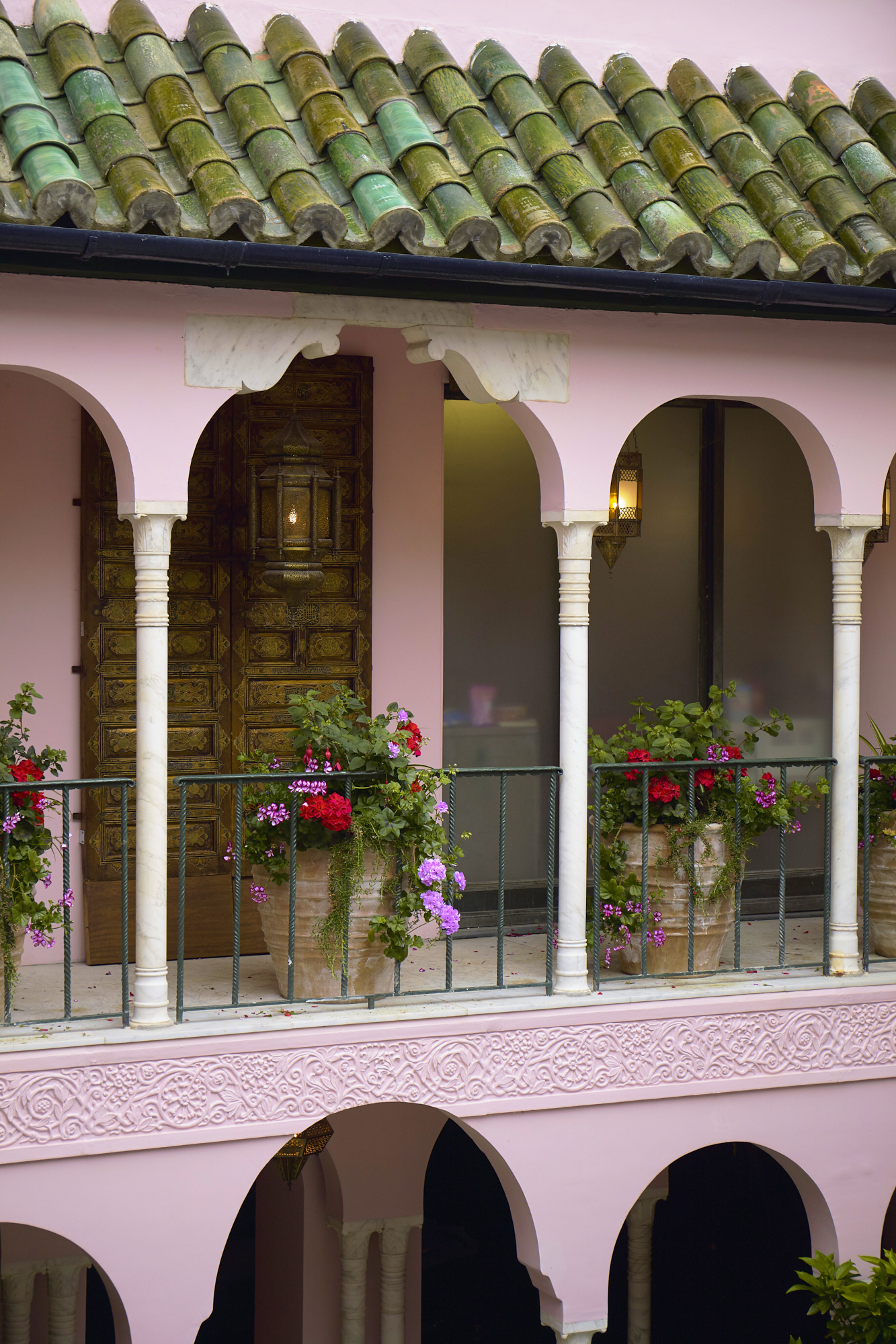 3 Bowen Dryden bridal captured in a pink Marrakech inspired courtyard at Port Lympne Hotel