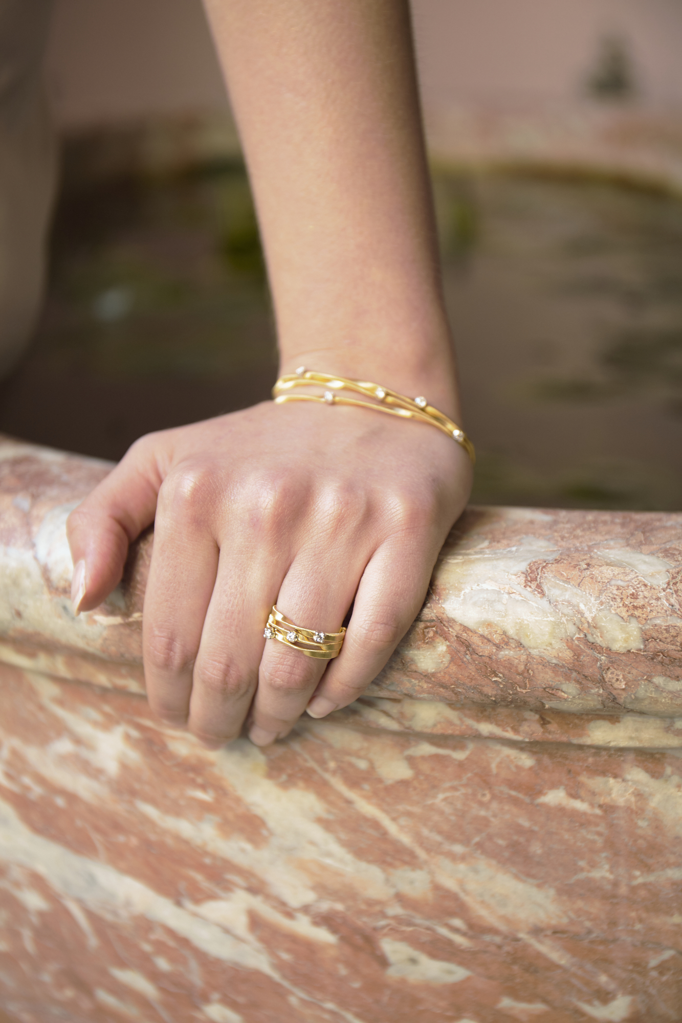 34 Bowen Dryden bridal captured in a pink Marrakech inspired courtyard at Port Lympne Hotel