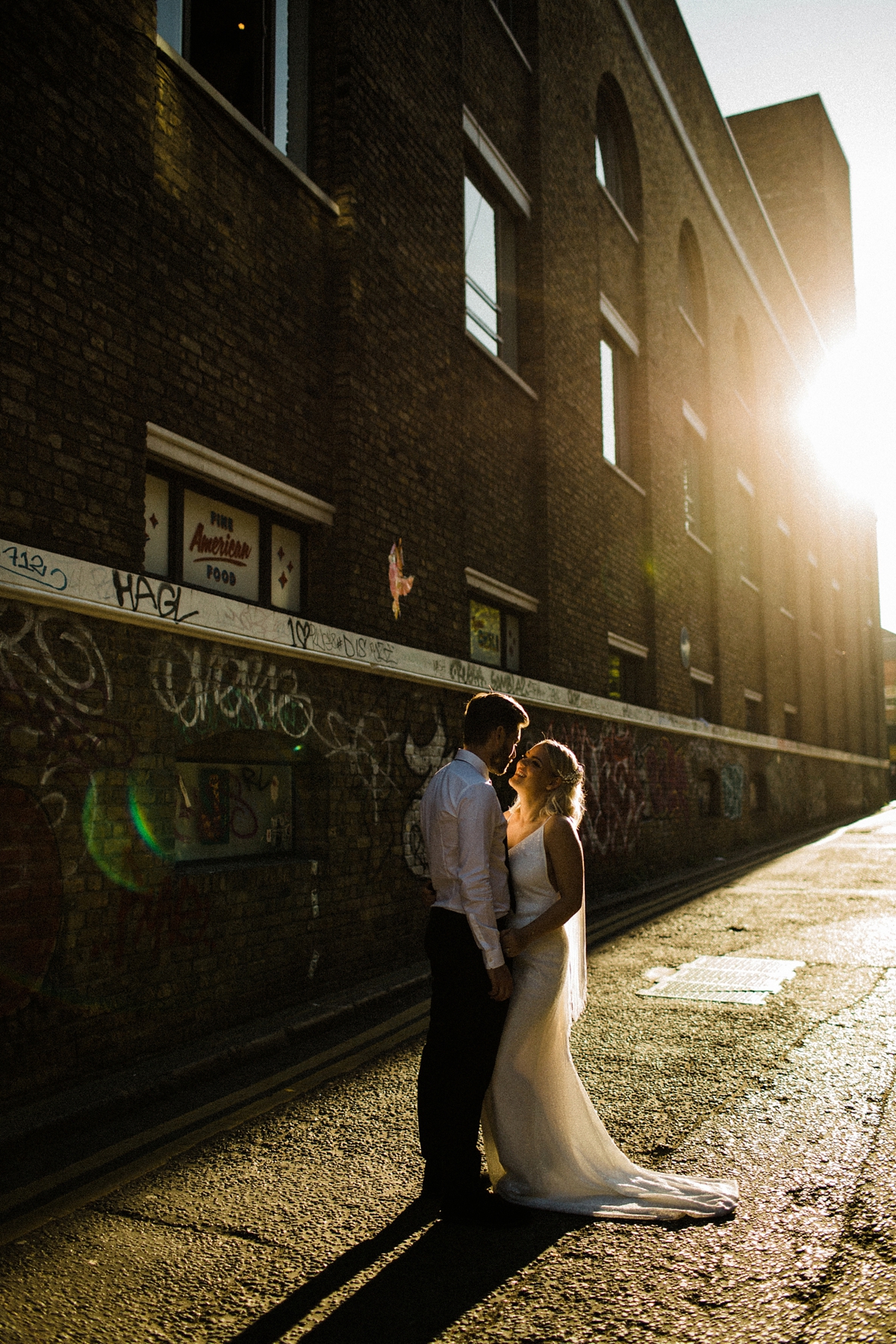39 For Love wedding dress for a cool and contemporary modern London wedding photography by Claudia Rose Carter - An & For Love Tassel Dress, Olivia The Wolf Headpiece and Bowling Alley Reception For a Cool and Quirky London Wedding 39 For Love wedding dress for a cool and contemporary modern London wedding photography by Claudia Rose Carter