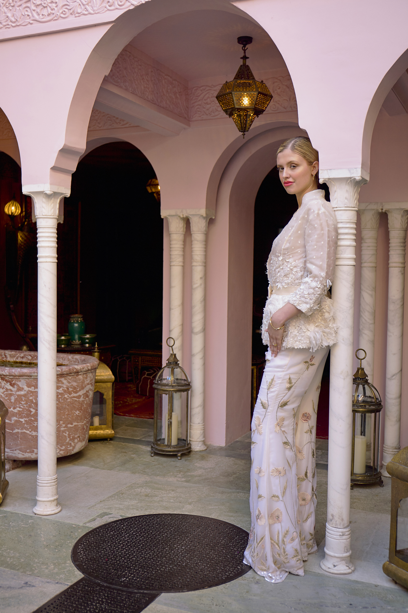 43 Bowen Dryden bridal captured in a pink Marrakech inspired courtyard at Port Lympne Hotel