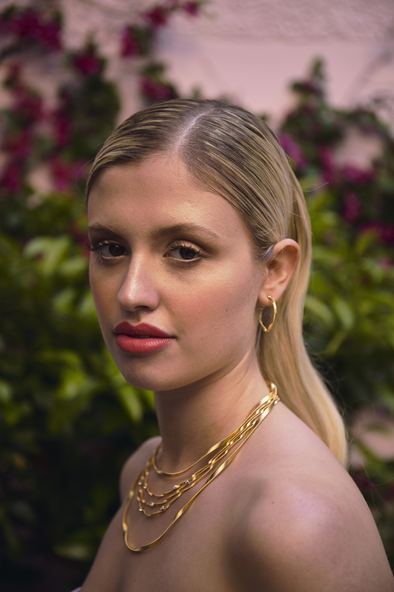 46 Bowen Dryden bridal captured in a pink Marrakech inspired courtyard at Port Lympne Hotel
