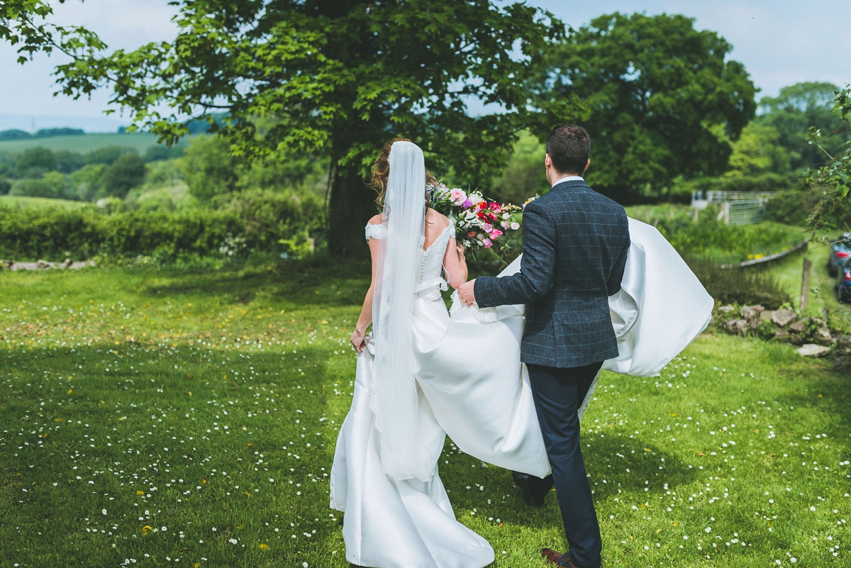 A Rosa Clara bride and her colourful garden inspired Welsh castle wedding 17