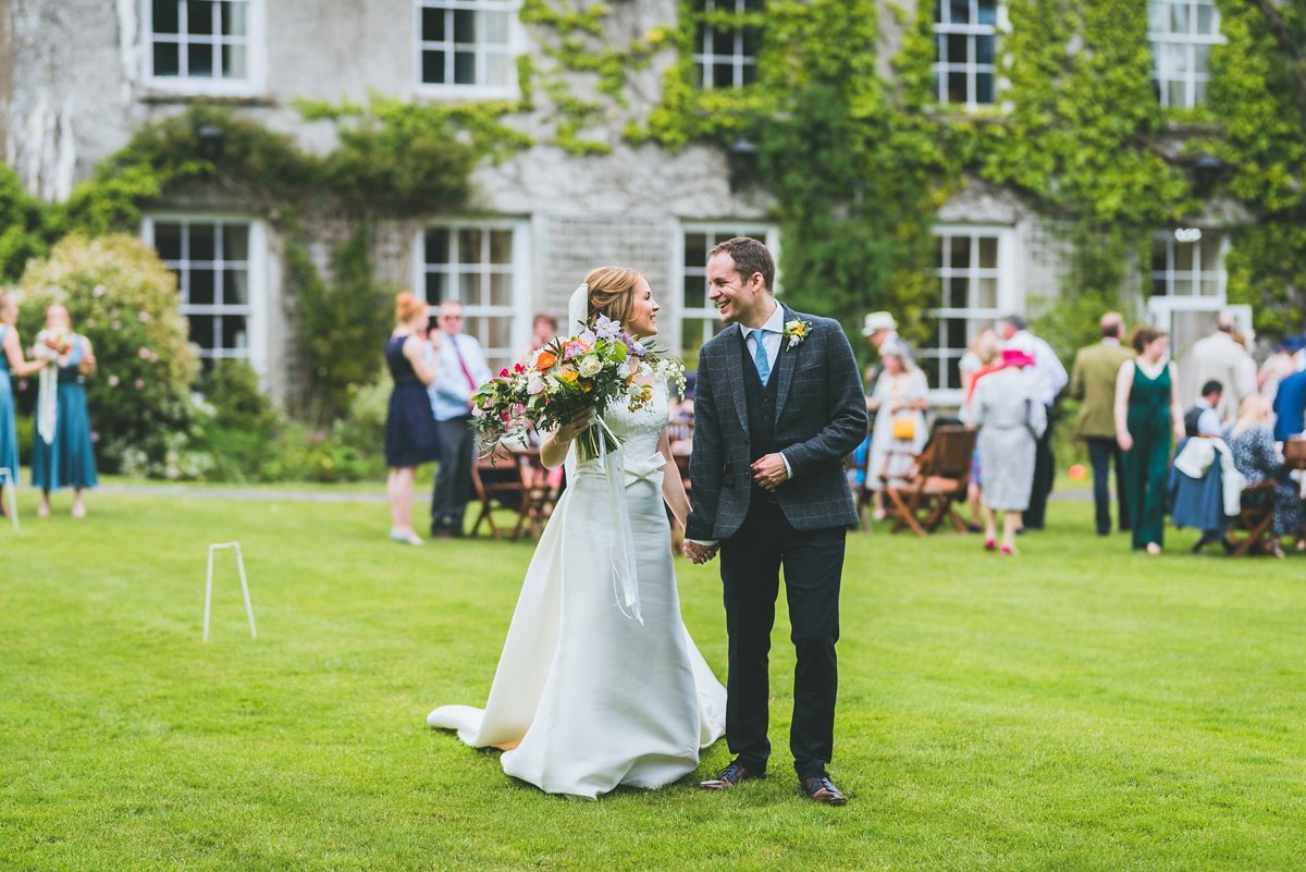 A Rosa Clara bride and her colourful garden inspired Welsh castle wedding 25