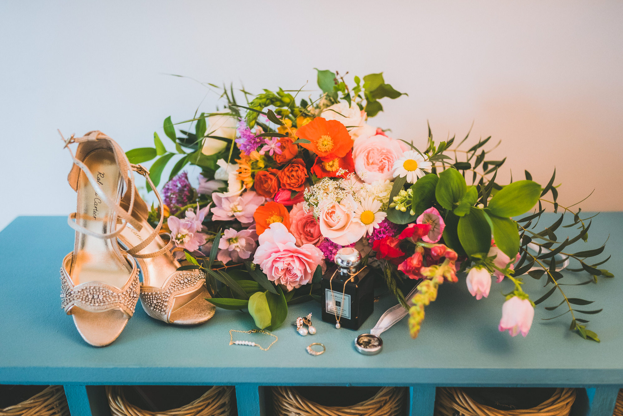Colourful wedding bouquet and gold open toe high heel wedding shoes