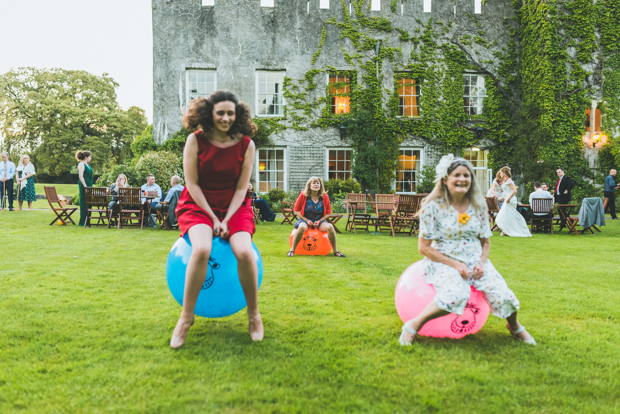 Wedding guests bouncing on Space Hoppers