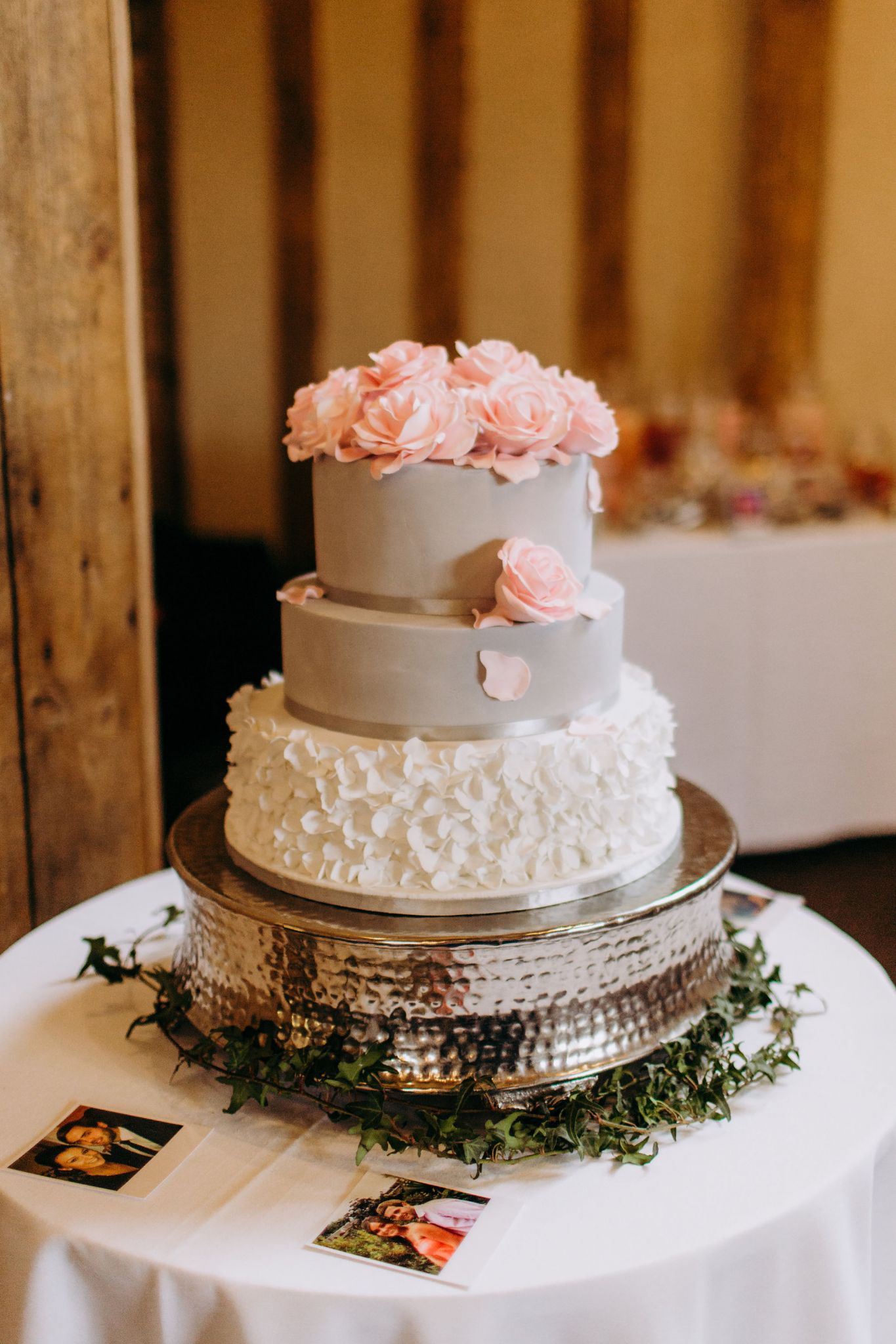 01 pale grey and white wedding cake topped with pale pink iced flowers