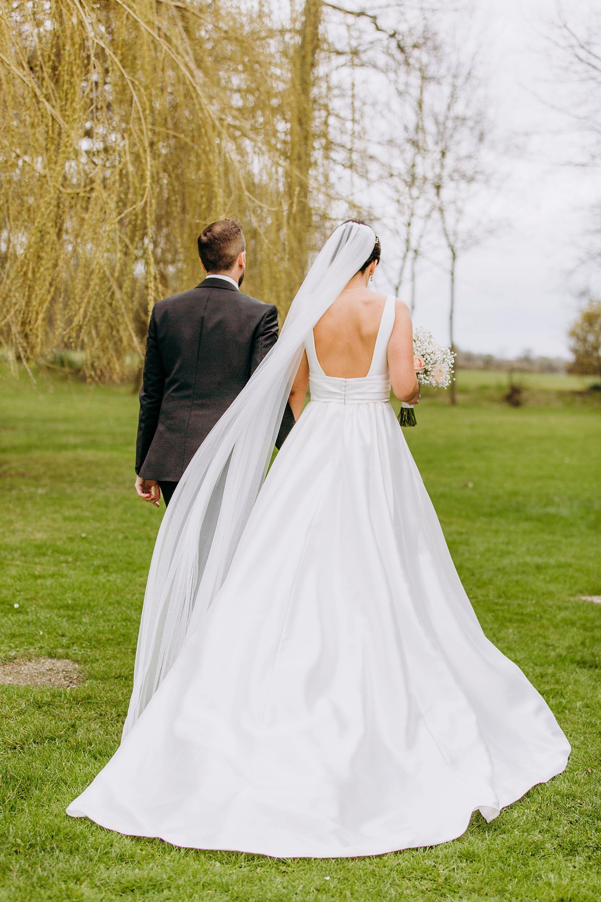 35 A silk Pronovias dress for a rainy day black tie wedding