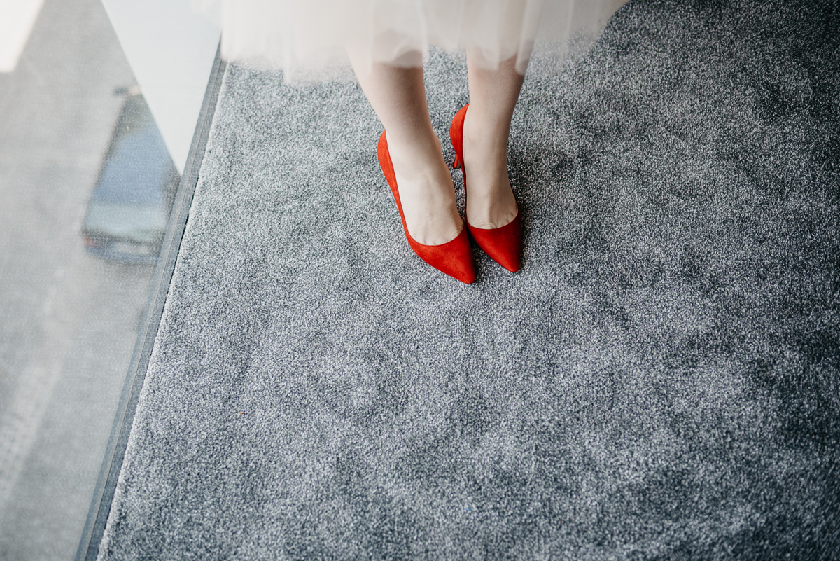 Short tulle skirt red shoes chic London family wedding Elaine Williams Photography 11