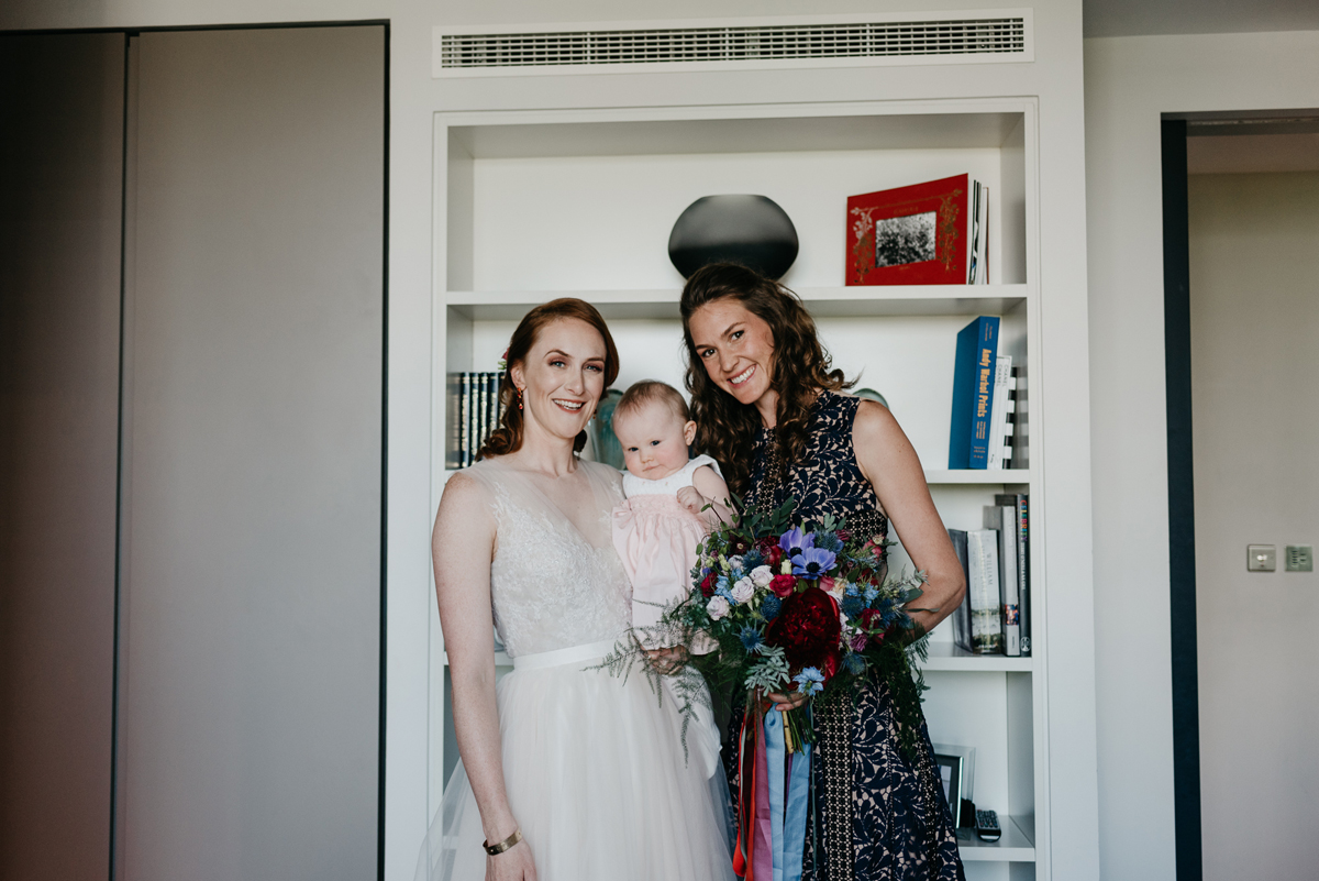 Short tulle skirt red shoes chic London family wedding Elaine Williams Photography 14