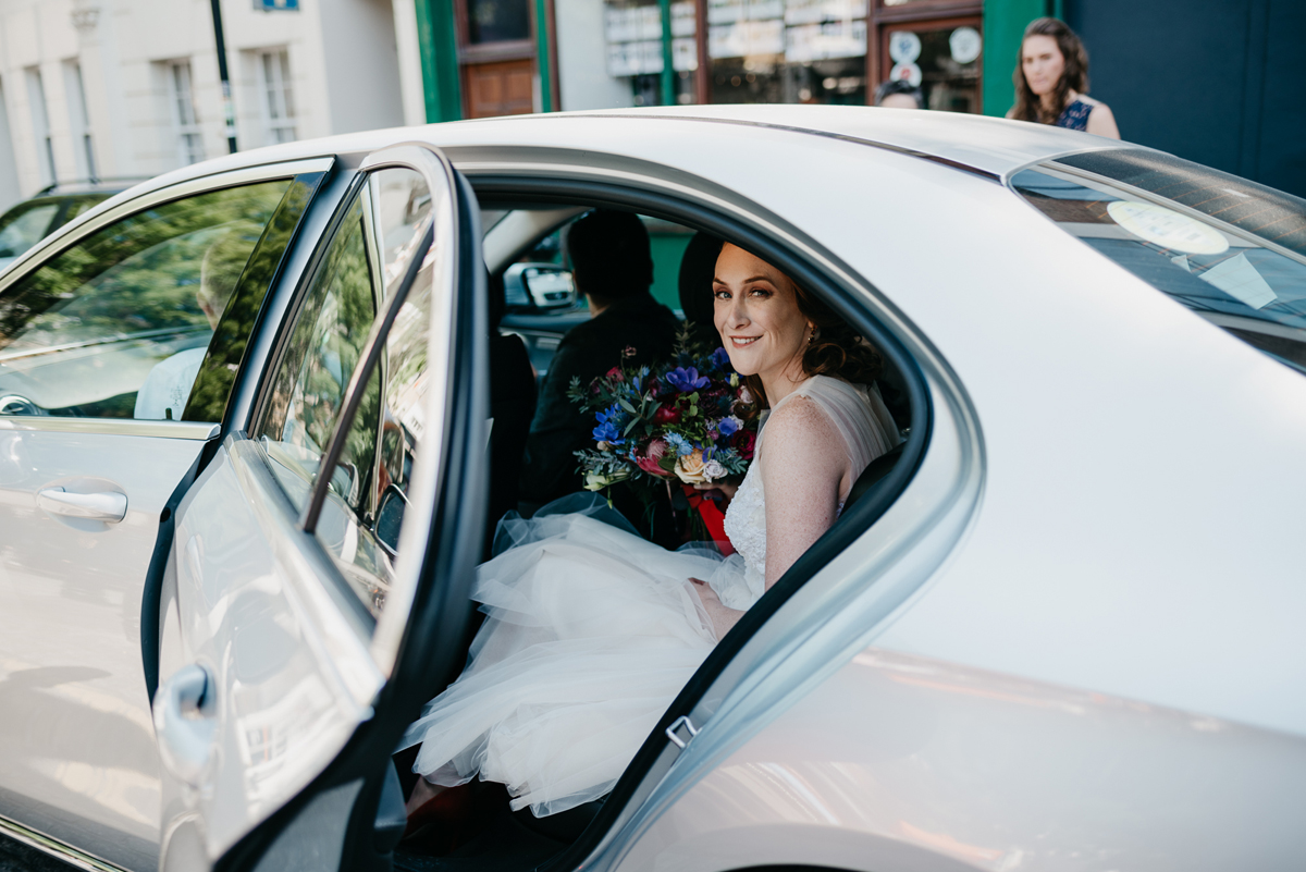 Short tulle skirt red shoes chic London family wedding Elaine Williams Photography 16