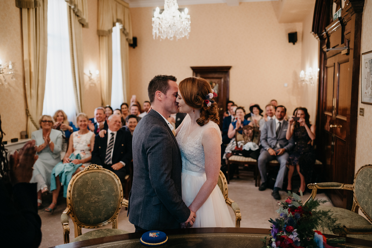 Short tulle skirt red shoes chic London family wedding Elaine Williams Photography 23